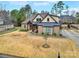 Beautifully landscaped home showcasing a brick exterior, covered porch, and a spacious front yard with mature trees at 894 Abilene Ln, Fort Mill, SC 29715