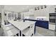 Stylish kitchen with a large island, white cabinets, modern appliances, and ample counter space at 894 Abilene Ln, Fort Mill, SC 29715