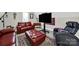 Comfortable living room showcasing stylish leather furniture, a patterned rug, and a modern entertainment setup at 894 Abilene Ln, Fort Mill, SC 29715