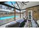 Inviting screened porch with comfortable seating and a view of the private pool area at 894 Abilene Ln, Fort Mill, SC 29715