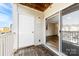 This balcony features wood flooring and a door and sliding glass door to the interior at 1068 Plaza Walk Dr, Charlotte, NC 28215