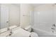 Well-maintained bathroom with a large vanity and a shower-tub combination at 1068 Plaza Walk Dr, Charlotte, NC 28215