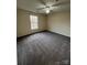 Bedroom with a ceiling fan, window and neutral walls at 1068 Plaza Walk Dr, Charlotte, NC 28215