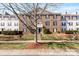 Charming condo complex with brick facade and well-maintained landscaping in a residential neighborhood at 1068 Plaza Walk Dr, Charlotte, NC 28215