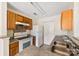 Bright kitchen featuring wood cabinets, neutral countertops and modern appliances at 1068 Plaza Walk Dr, Charlotte, NC 28215