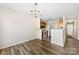 Combined living and kitchen area with hardwood floors and neutral decor at 1068 Plaza Walk Dr, Charlotte, NC 28215