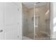 Modern bathroom showcasing a glass-enclosed shower with neutral tiling and a built-in niche for added convenience at 116 Shay Crossing Rd # 2P, Salisbury, NC 28144