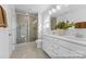 Bright bathroom featuring a dual vanity, large mirror, and a glass-enclosed shower with modern fixtures and tile at 116 Shay Crossing Rd # 2P, Salisbury, NC 28144