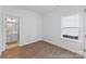 Bright bedroom features hardwood floors, a neutral palette, and an ensuite bathroom at 116 Shay Crossing Rd # 2P, Salisbury, NC 28144
