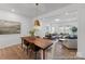 Modern dining room features stylish lighting, hardwood floors, and a view of the living room at 116 Shay Crossing Rd # 2P, Salisbury, NC 28144