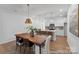 Modern dining room features stylish lighting, hardwood floors, and a view of the kitchen at 116 Shay Crossing Rd # 2P, Salisbury, NC 28144
