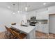 Bright kitchen with stainless appliances, quartz countertops, and a stylish island with seating at 116 Shay Crossing Rd # 2P, Salisbury, NC 28144