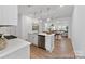 Open-concept kitchen features stainless steel appliances, quartz countertops, and bar seating at 116 Shay Crossing Rd # 2P, Salisbury, NC 28144