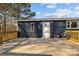 The back porch has railings and plenty of space for chairs overlooking the backyard and plenty of sunlight at 1254 Raxter Rd, Edgemoor, SC 29712