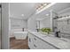 Bathroom with dual vanities, a soaking tub, a walk-in shower, and modern fixtures at 1254 Raxter Rd, Edgemoor, SC 29712