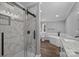 Modern bathroom with walk-in shower, soaking tub, and granite counters at 1254 Raxter Rd, Edgemoor, SC 29712