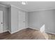 Bright bedroom showcasing luxury vinyl floors, white trim, and a neutral color scheme at 1254 Raxter Rd, Edgemoor, SC 29712