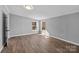 Cozy bedroom features hardwood floors, neutral paint, and plenty of natural light from the windows at 1254 Raxter Rd, Edgemoor, SC 29712