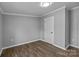 Bright bedroom showcasing luxury vinyl floors, white trim, and a neutral color scheme at 1254 Raxter Rd, Edgemoor, SC 29712