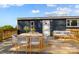 Outdoor deck featuring a dining table set with chairs and a comfortable sofa set perfect for relaxing and enjoying the view at 1254 Raxter Rd, Edgemoor, SC 29712