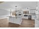 Spacious kitchen features a large island, stainless appliances, and white cabinetry at 1254 Raxter Rd, Edgemoor, SC 29712