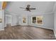Open-concept living room showcases hardwood flooring, large windows, and neutral paint throughout at 1254 Raxter Rd, Edgemoor, SC 29712