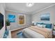 Bright main bedroom features two windows, luxury vinyl floors, and neutral walls at 1254 Raxter Rd, Edgemoor, SC 29712