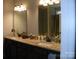 Double vanity bathroom with granite countertop and dark wood cabinetry at 128 Summerlake Dr, New London, NC 28127