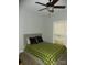 Bedroom with a ceiling fan, natural light, and modern decor at 128 Summerlake Dr, New London, NC 28127