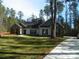 Charming single story home with brick and white siding on a spacious lot with mature trees at 128 Summerlake Dr, New London, NC 28127