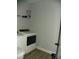 Laundry room with modern white appliances and ample storage space at 128 Summerlake Dr, New London, NC 28127