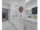 Elegant bathroom with a double vanity, marble countertops, and a decorative mirror at 16709 Mckee Rd, Charlotte, NC 28278