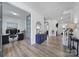 A view from the entryway into an office, hallway, living room and stairwell of the home at 16709 Mckee Rd, Charlotte, NC 28278