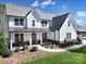 Charming farmhouse-style home featuring a covered porch, well-maintained landscaping, and a welcoming entrance at 16709 Mckee Rd, Charlotte, NC 28278