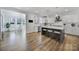 Gourmet kitchen features an oversized island with seating and stainless steel appliances at 16709 Mckee Rd, Charlotte, NC 28278