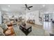 A bright open living room flows into the kitchen and features contemporary furnishings and hardwood floors at 16709 Mckee Rd, Charlotte, NC 28278