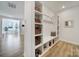 Mudroom features built-in storage, bench, shelving, and coat hooks providing space to keep organized at 16709 Mckee Rd, Charlotte, NC 28278