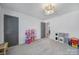 Gray walled playroom with room for a play kitchen, dollhouse, and other toys at 16709 Mckee Rd, Charlotte, NC 28278