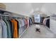 Spacious walk-in closet featuring custom shelving, built-ins, and ample storage space for an organized wardrobe at 16709 Mckee Rd, Charlotte, NC 28278