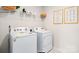 Bright laundry room features a side-by-side washer and dryer at 345 Brinkley Dr, Kings Mountain, NC 28086