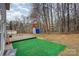 Large backyard with a deck, green turf, and a shed at 2444 Fabyan Ln, Charlotte, NC 28262