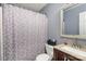 Neutral bathroom featuring a shower-tub combo with a patterned shower curtain at 2444 Fabyan Ln, Charlotte, NC 28262