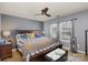 Comfortable bedroom with a large bed, two windows, and a ceiling fan at 2444 Fabyan Ln, Charlotte, NC 28262