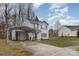 Charming two-story home with carport and landscaped front yard at 2444 Fabyan Ln, Charlotte, NC 28262