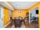Eat-in kitchen featuring stainless steel appliances, wood-look flooring, and warm colored walls at 2444 Fabyan Ln, Charlotte, NC 28262