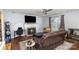 Cozy living room with fireplace, TV, and comfortable seating area at 2444 Fabyan Ln, Charlotte, NC 28262