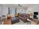 Inviting living area featuring a leather sofa, area rug and natural lighting at 2444 Fabyan Ln, Charlotte, NC 28262