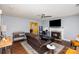 Comfortable living room with a fireplace, TV, and open kitchen view at 2444 Fabyan Ln, Charlotte, NC 28262