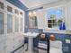 Charming bathroom featuring a pedestal sink, built-in storage, and a window with natural light at 253 Misenheimer Nw Dr, Concord, NC 28025
