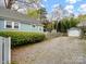 Long driveway alongside a lovely home with verdant landscaping at 253 Misenheimer Nw Dr, Concord, NC 28025
